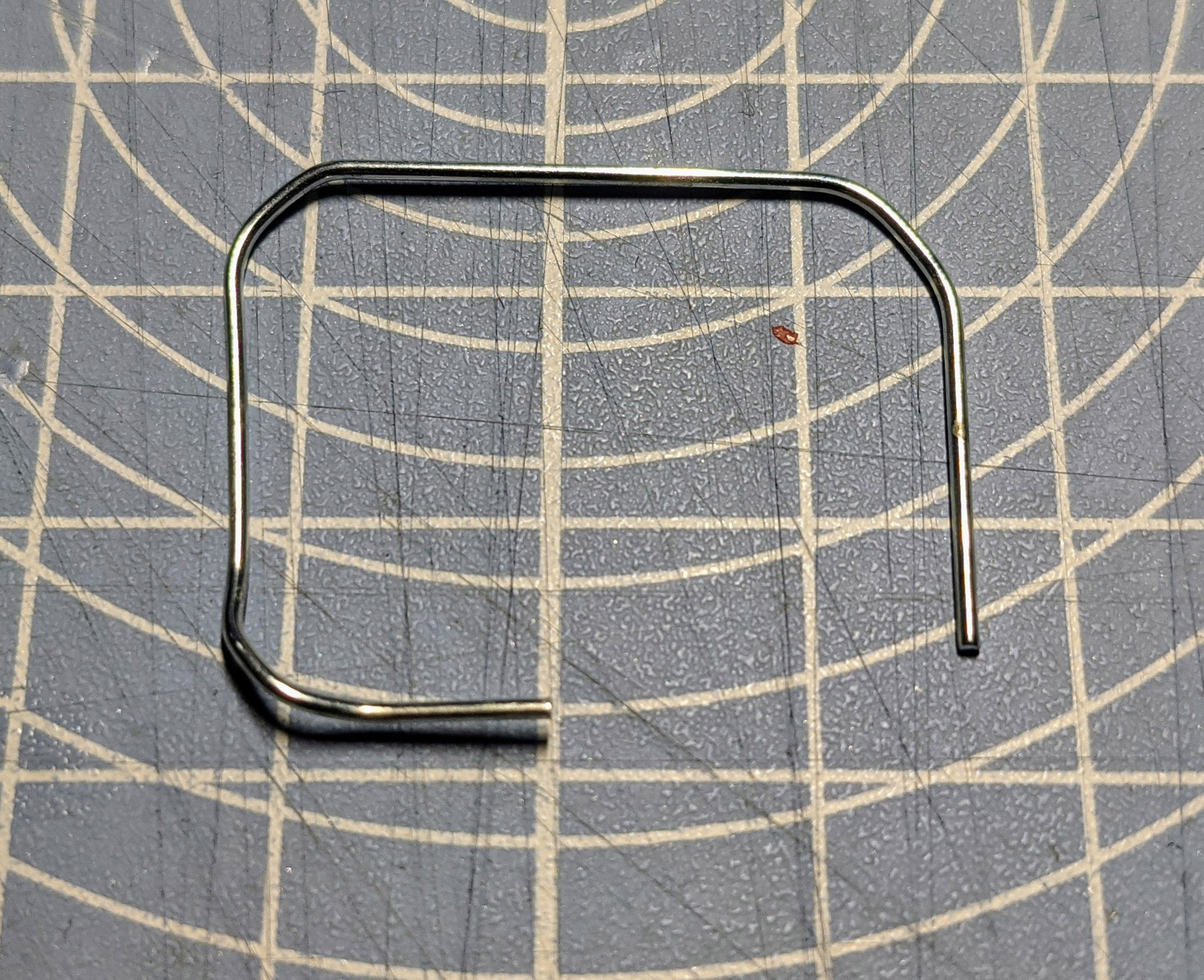 Fold open the paperclip to form a square.